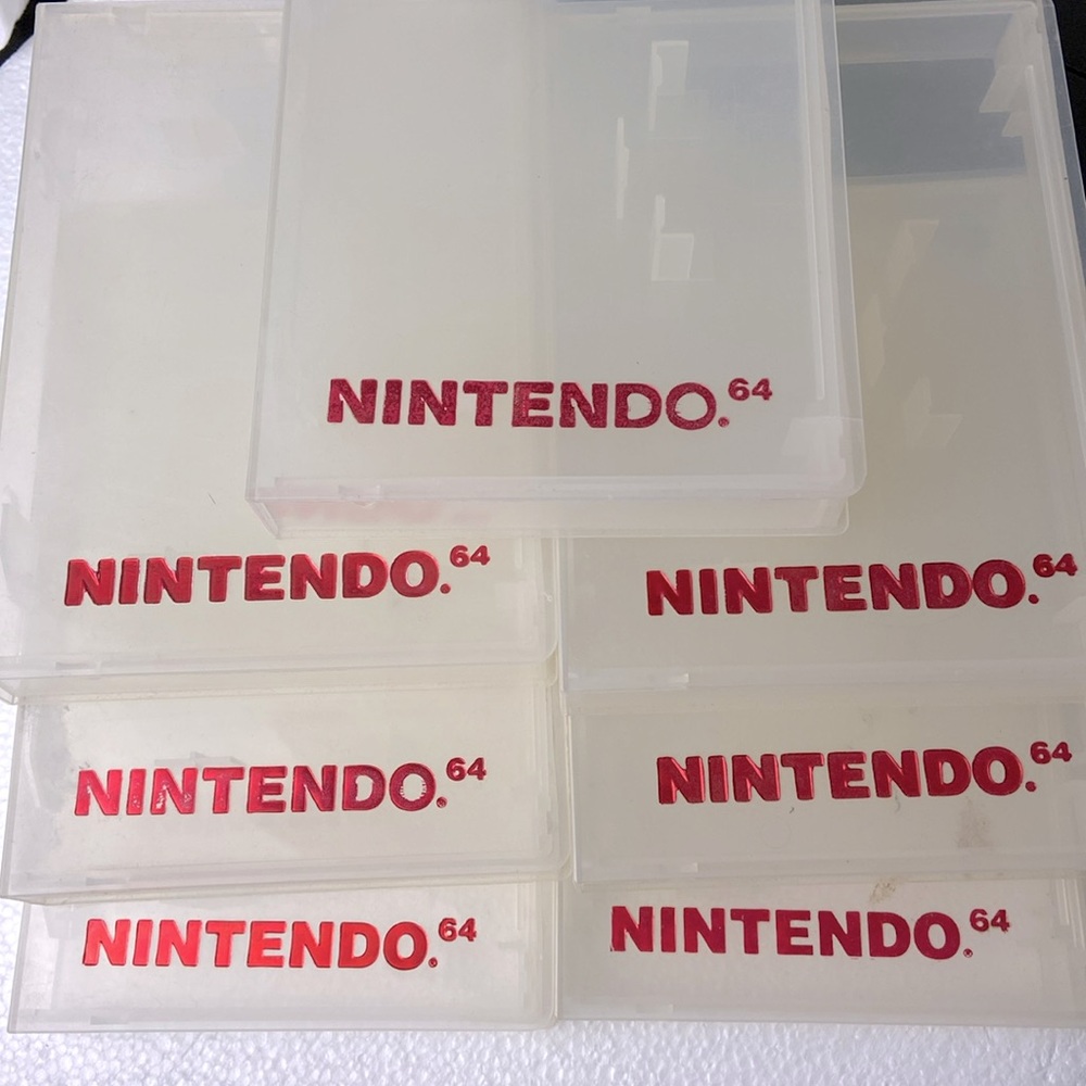 Vintage Nintendo Seven (7) official Nintendo 64 Clam Shell Clear Cases